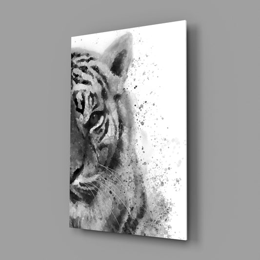 Black and white watercolor tiger head with ink splatter effect transitioning to white, displayed as angled glass wall art against gray background.