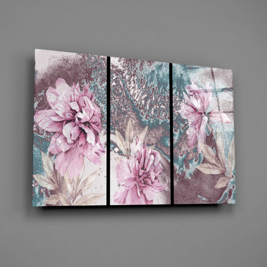 Three-panel glass wall art displaying pink peonies with teal and mauve distressed marble textures, mounted horizontally on gray wall.