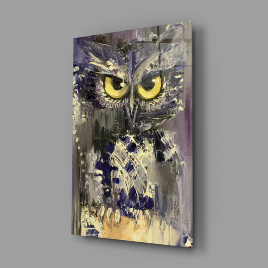 Abstract owl with striking yellow eyes mounted on canvas, displayed at an angle against a gray wall.