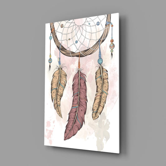 Glass wall art displaying a boho dreamcatcher with three ornate feathers in tan, brown, and mauve, beaded strings, and watercolor background, angled perspective view.