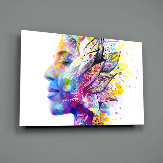Colorful glass wall art displaying a profile silhouette filled with watercolor washes, feather designs, and abstract splatter patterns in vibrant multi-colors against white background.