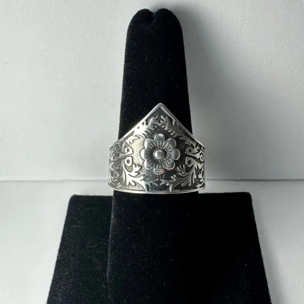 Ornate silver floral garden ring with swirling vine filigree details