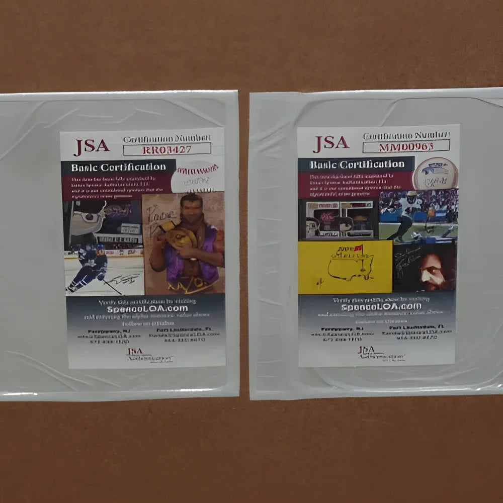 Two clear plastic-wrapped jsa basic certification cards for deluxe framed ozark tv poster autographed by jason bateman and laura linney