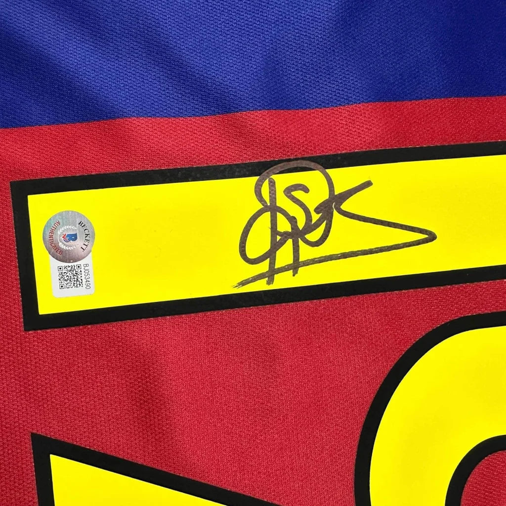 Signed Patrick Kluivert framed football jersey with red, blue, and yellow stripes