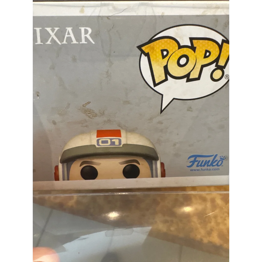 Patrick Warburton signed Funko Pop figure of a character with a white and orange helmet