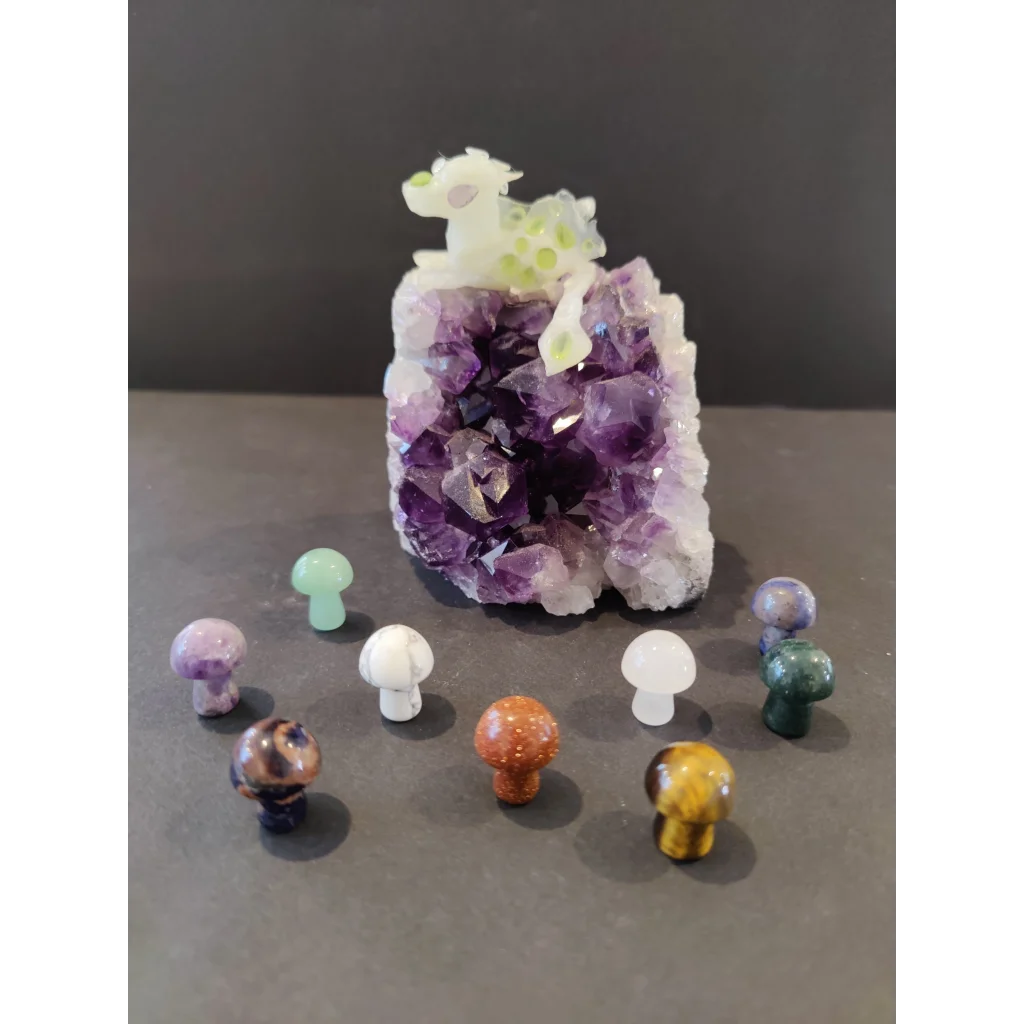 Polished purple amethyst geode with mushroom stone sculpture figurine