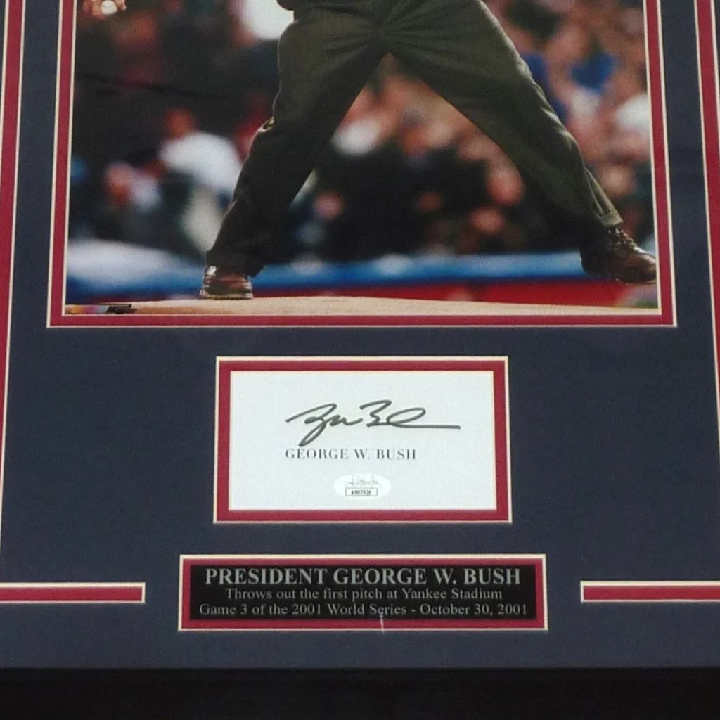 Signed framed 11x14 photo of President George W. Bush throwing first pitch with autograph