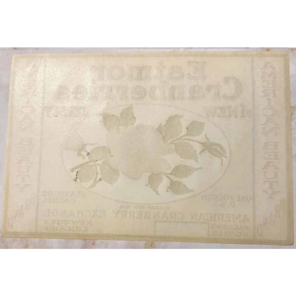 Faded paper with floral designs on the Rare 1920s Eatmor Cranberries Label