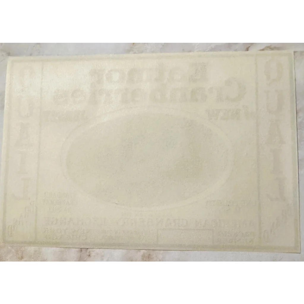 White rectangular bath mat next to Rare 1920s Eatmor Cranberries Quail Label