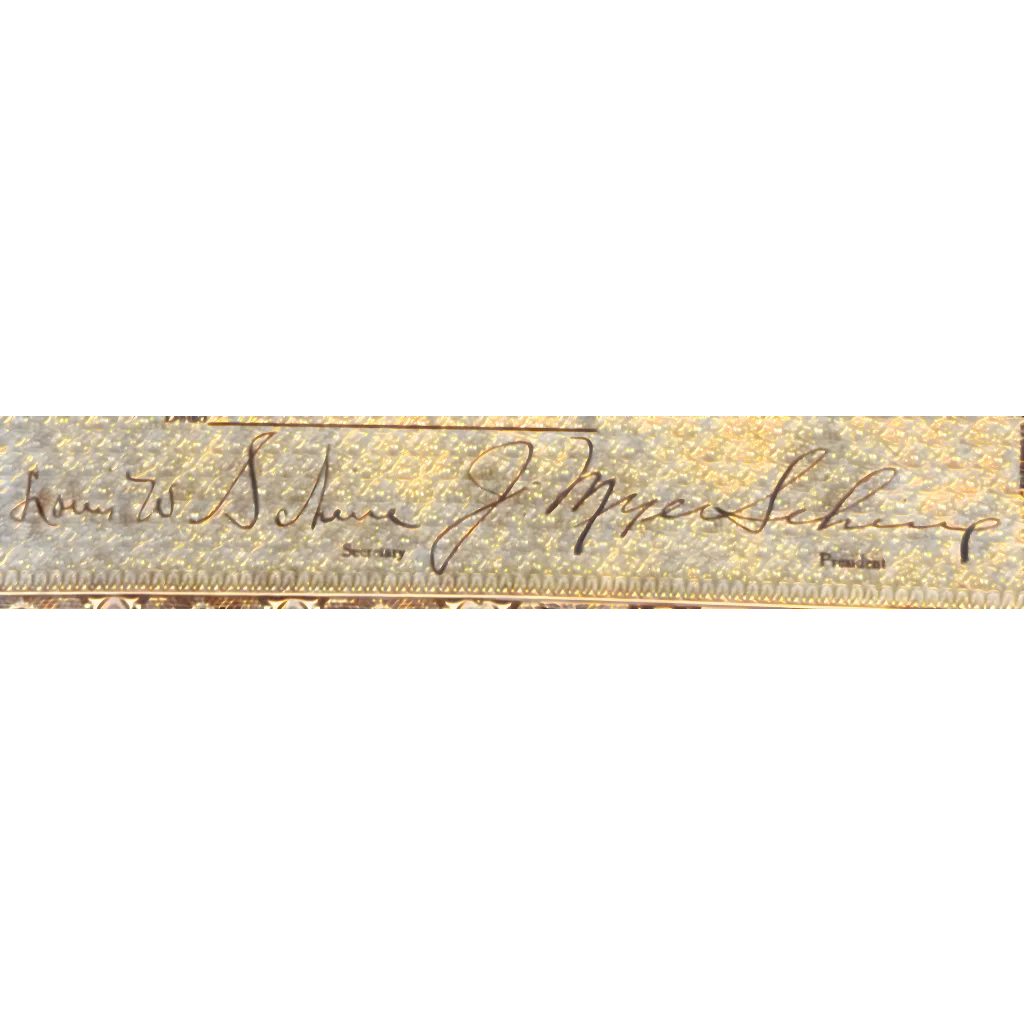 Handwritten signature on a beige surface of a Rare 1920s Schine Chain Theatres stock certificate