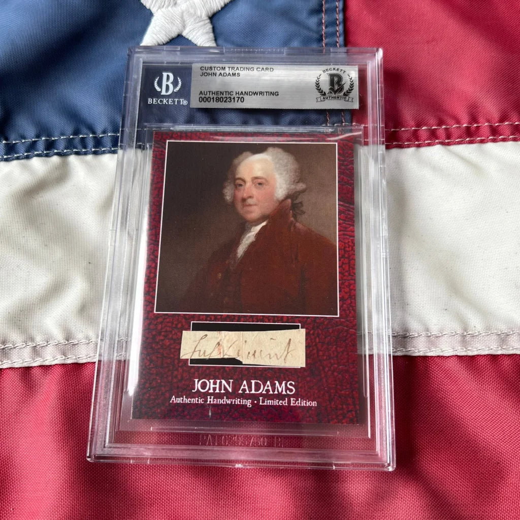 A rare John Adams Beckett-certified trading card with portrait on deep red textured cardboard and authentic handwriting strip