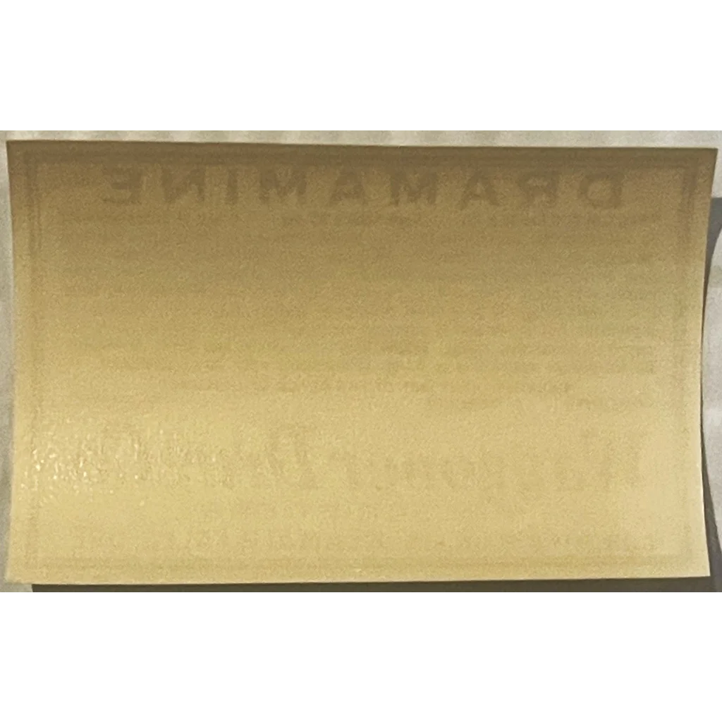 Manila envelope with faint text showcasing a Rare Vintage 1940s Dramamine label