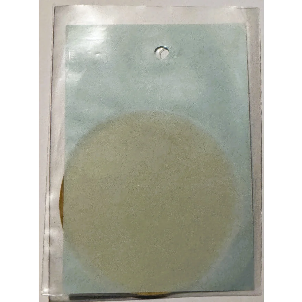 Round pale yellow sponge in plastic packaging from Rare Vintage 1960s Civil Defense decal