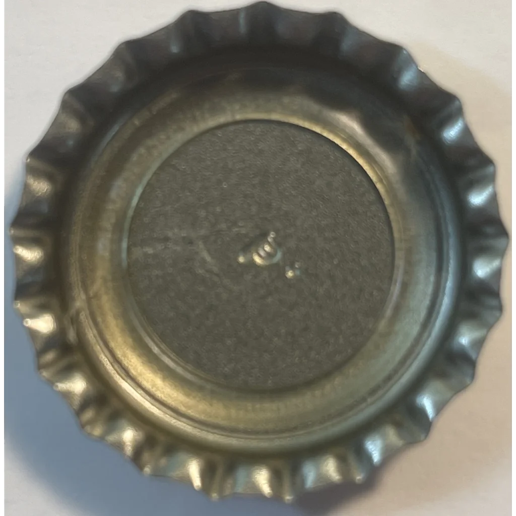 Metal Jolt Cola bottle cap with a ridged edge, perfect for 80s nostalgia lovers