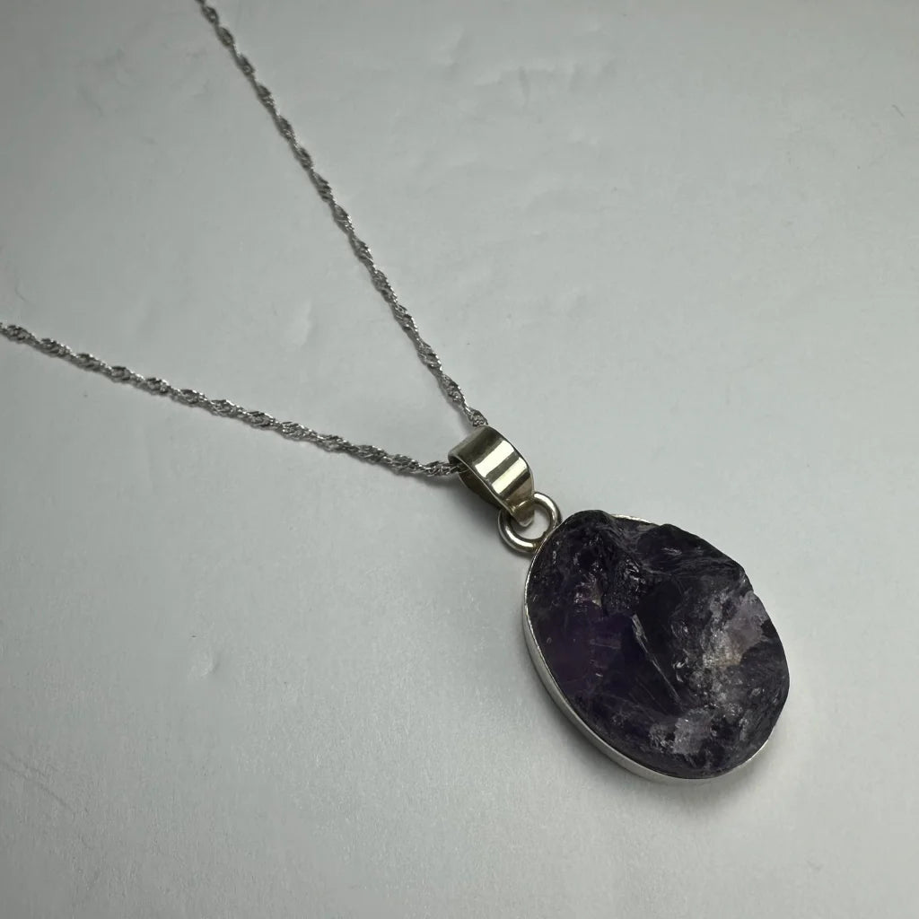 Raw oval amethyst pendant in sterling silver necklace