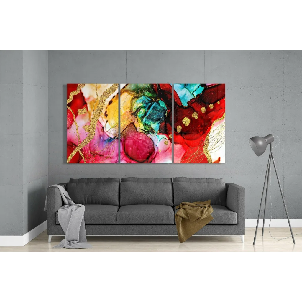 Vibrant swirling gold leaf abstract triptych glass wall art in reds, pinks, blues