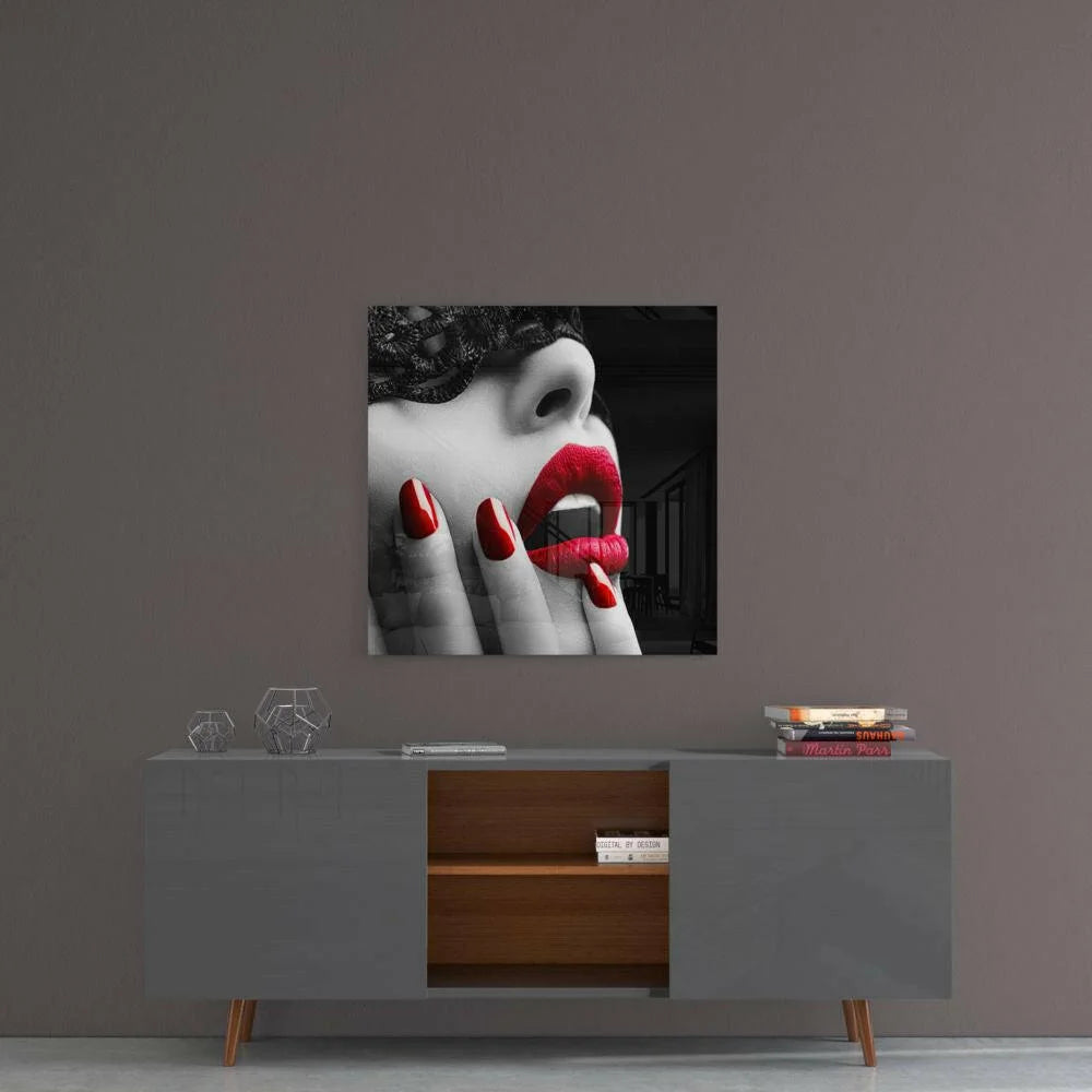 Bold red lips on black-and-white woman’s face in glass wall art