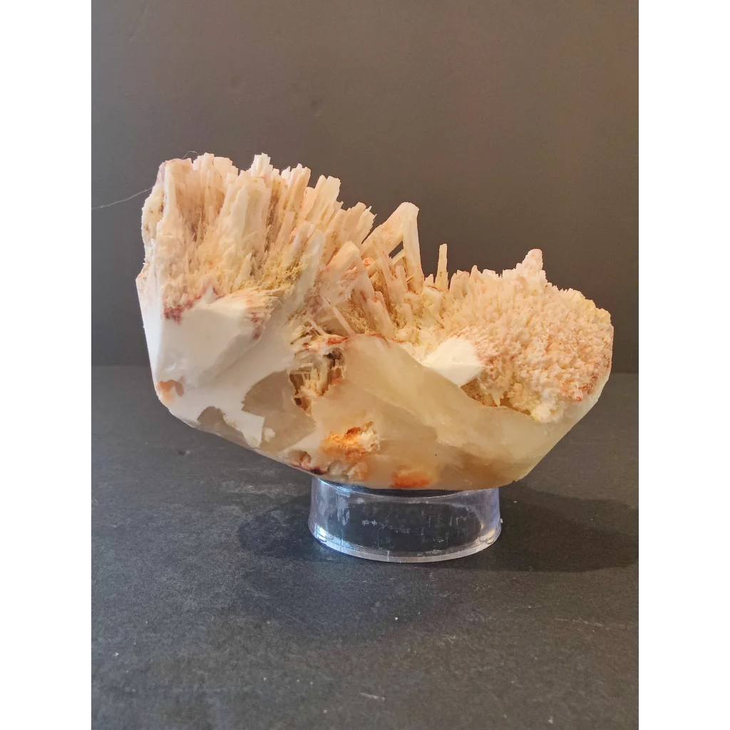 Red mordenite specimen 298g: translucent cream geode with crystals