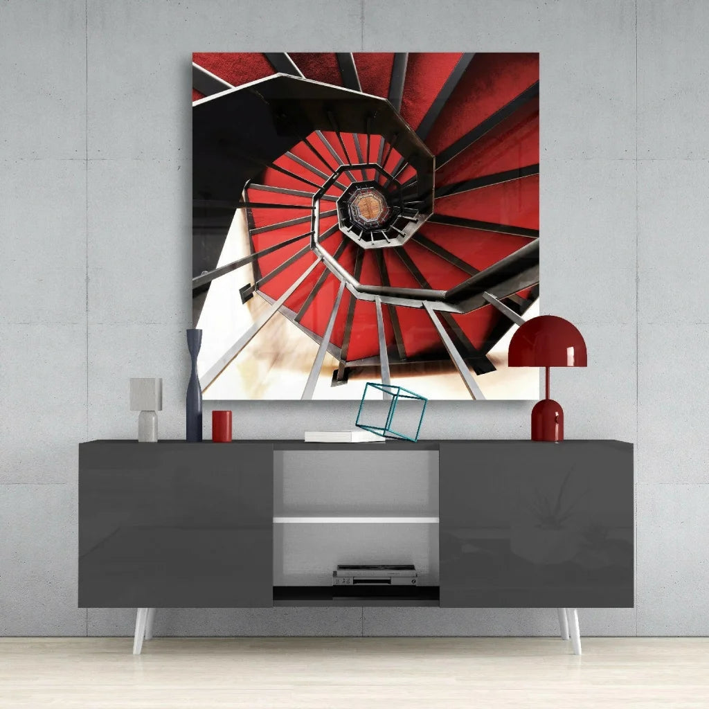 Bold red black spiral staircase wall art canvas print on gray console