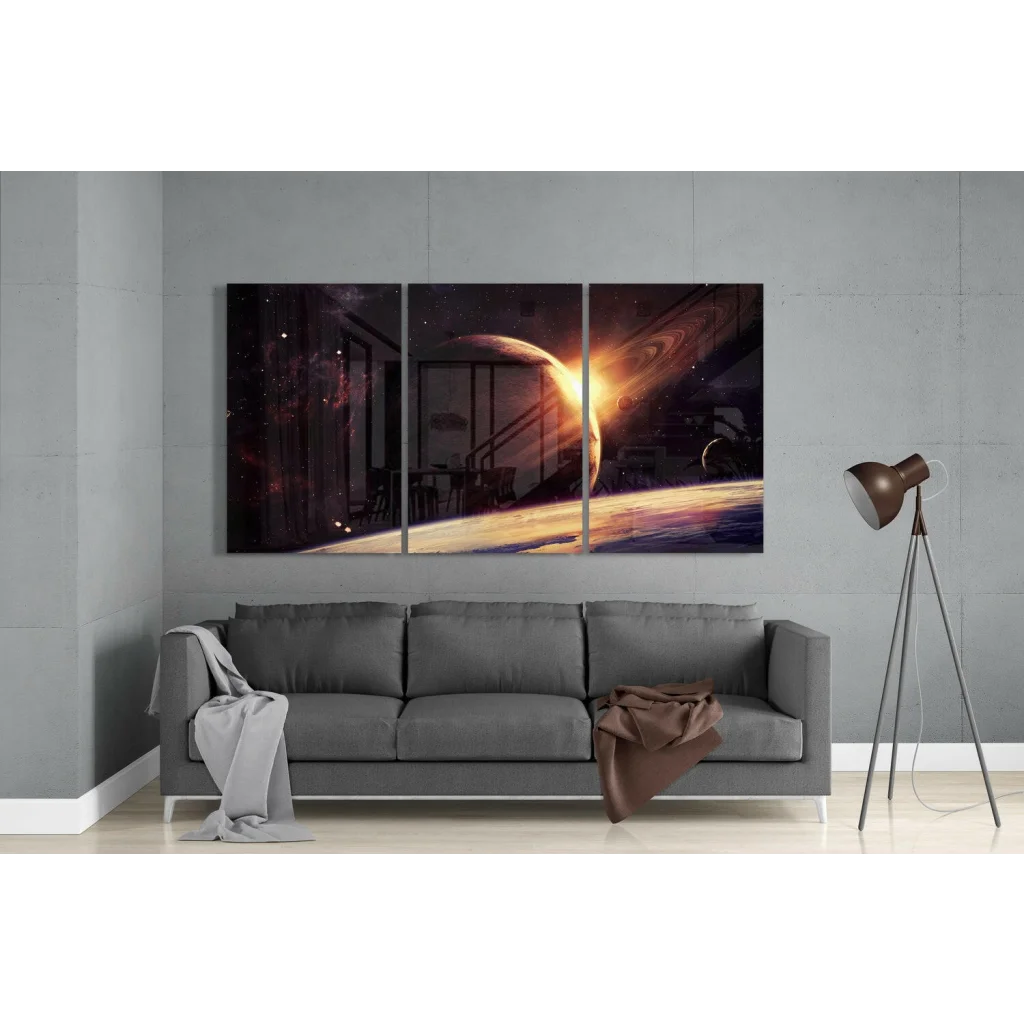 Three-panel glowing ringed planet space wall art canvas set above sofa