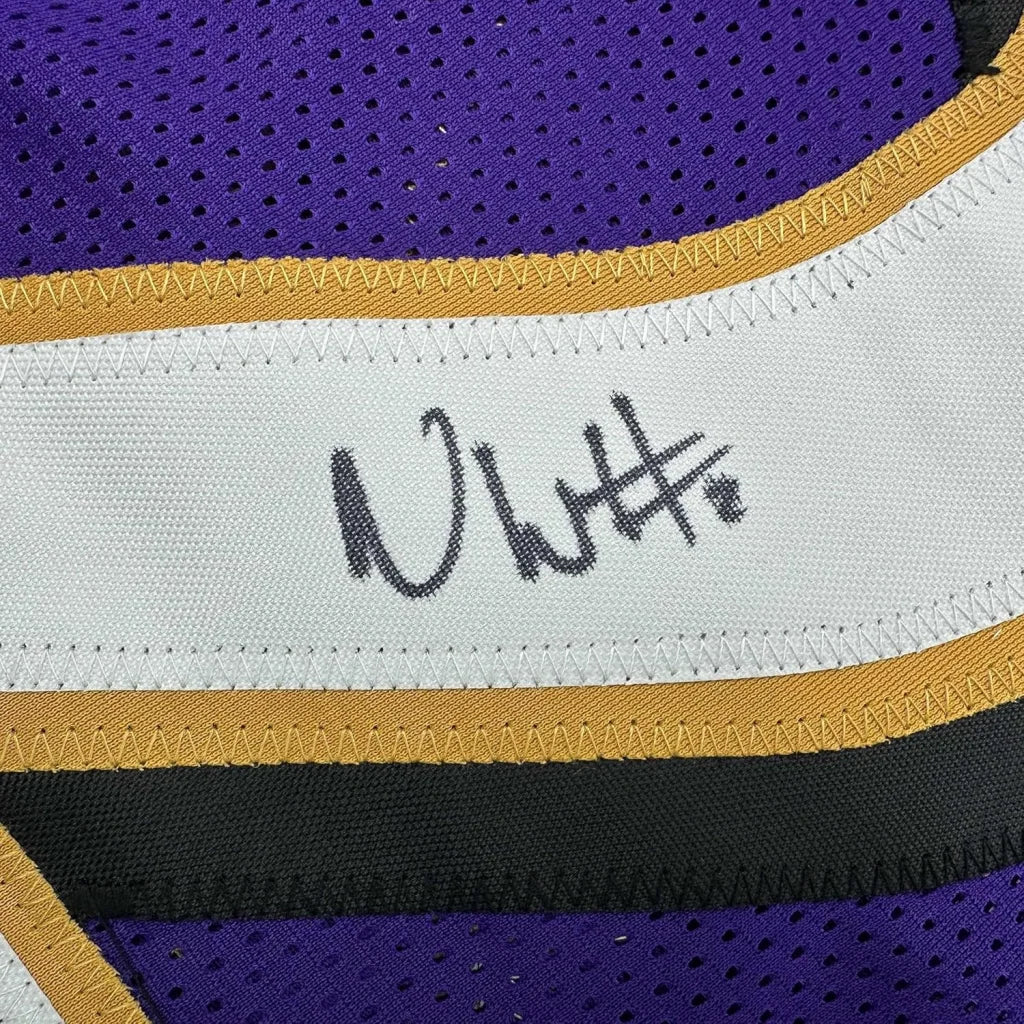 Framed signed Andrew Wiggins Ravens jersey in purple gold mesh with white stripe