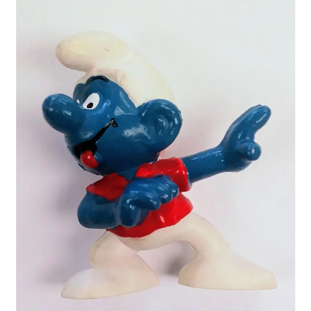 Skateboard Smurf PVC figure in chef hat and apron with nostalgic charm