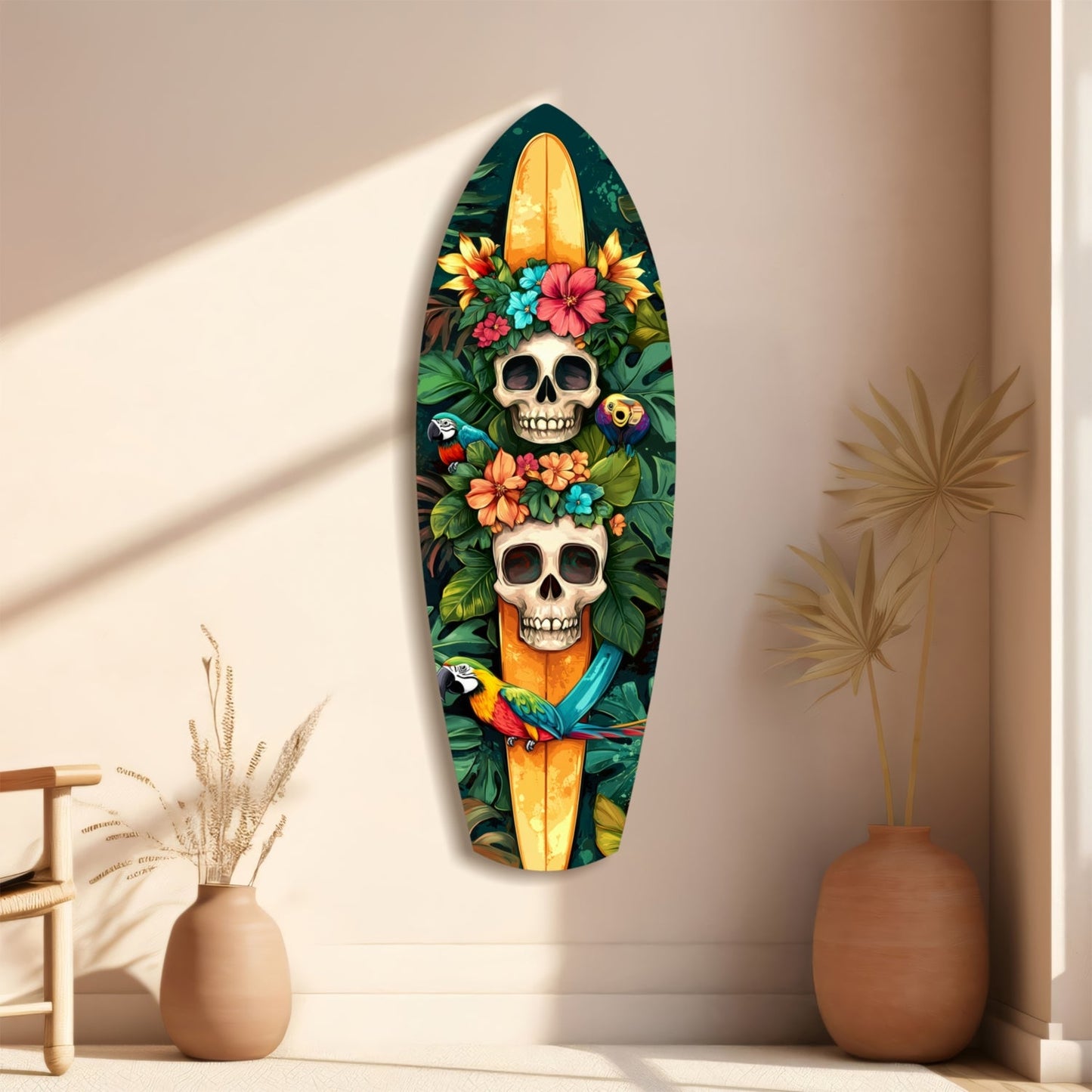Surfboard-shaped glass wall art featuring two skulls adorned with colorful flowers and parrots, displayed on a beige wall beside ceramic vases.