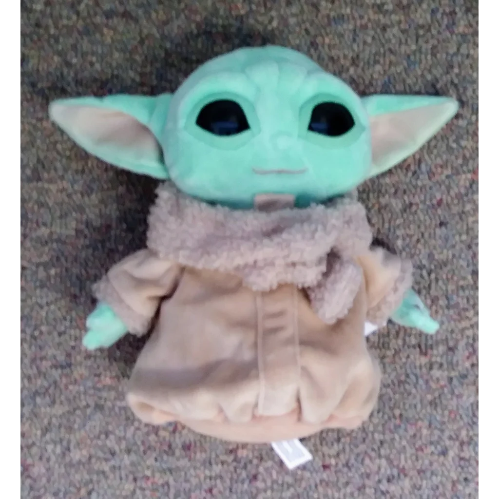 Cute Star Wars plush Grogu Baby Yoda toy in tan and green fur