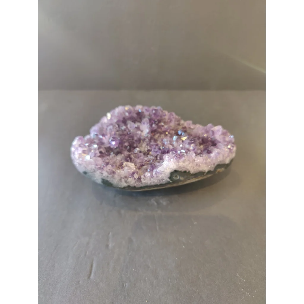 Vibrant amethyst cut base geode with sparkling crystals