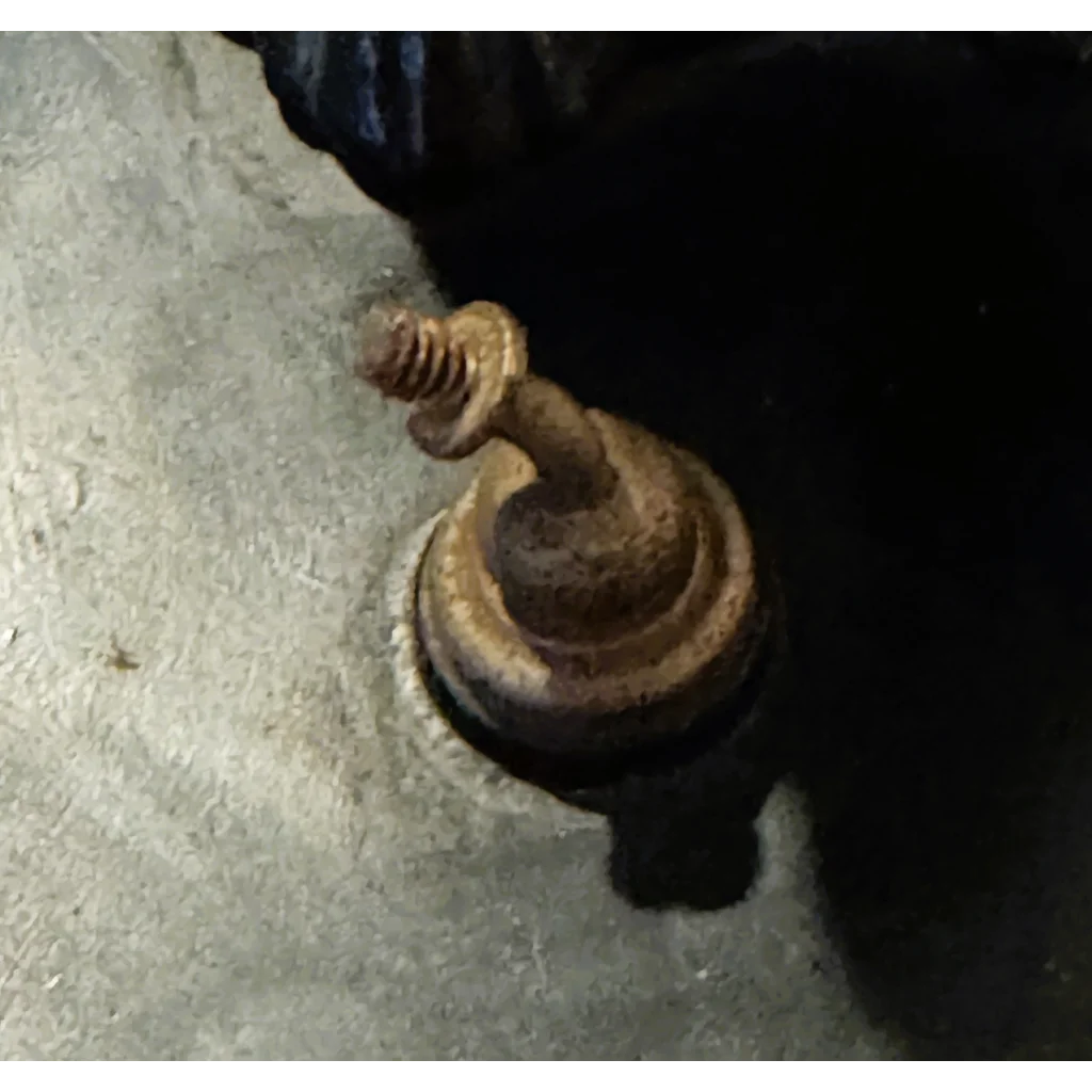 Rusty tiered threaded metal knob on Art Deco Bulldog Inkwell Collectible Figurine