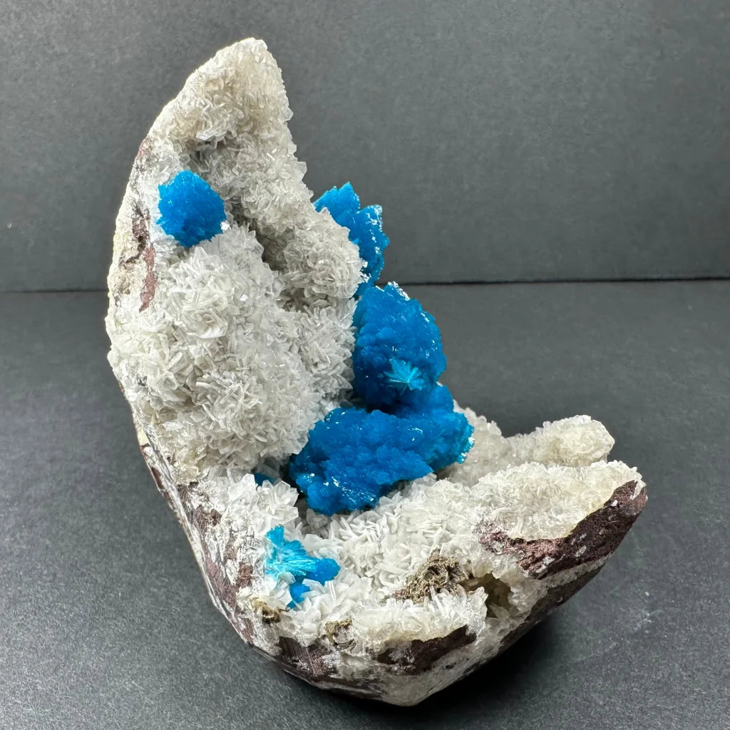 Vibrant blue cavansite on white stilbite matrix from Maharashtra