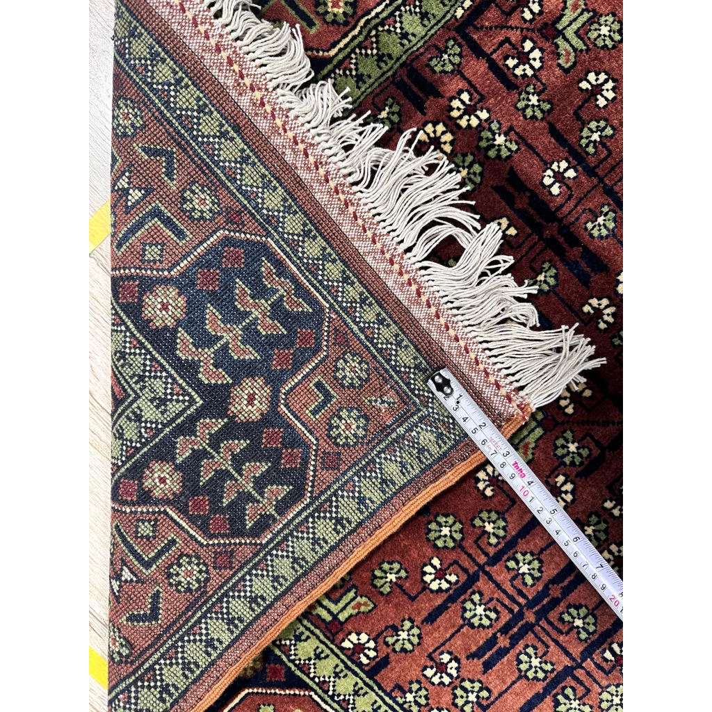 Stunning burgundy Bukharayi rug with intricate Afghani patterns