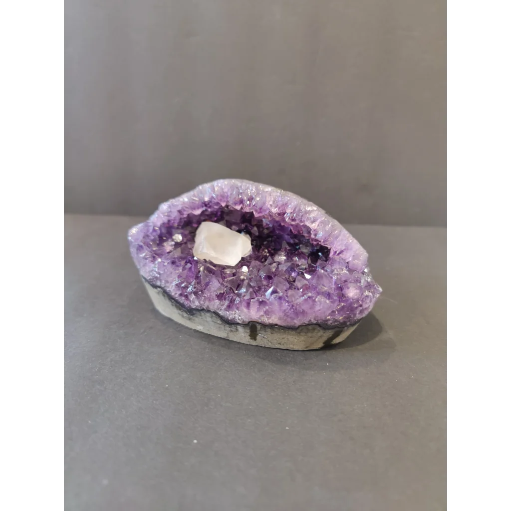 Polished purple amethyst calcite crystal inclusion geode sculpture from Brazil