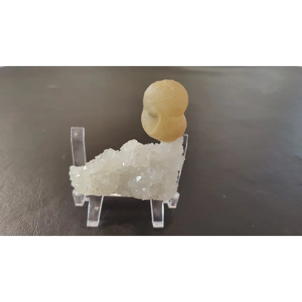 Pale yellow fluorite ball on quartz matrix from India