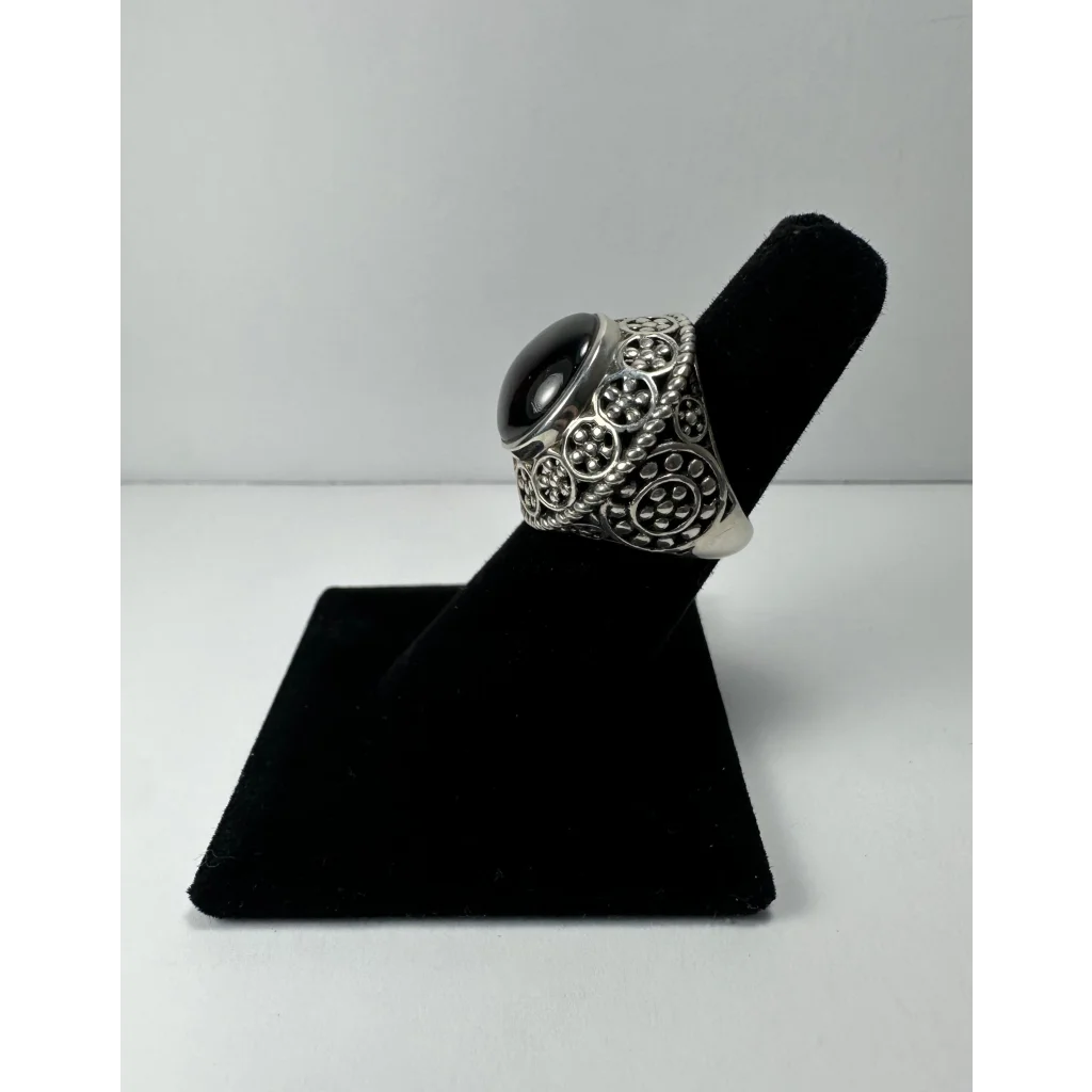 Stunning garnet ring with ornate silver filigree and black onyx stone
