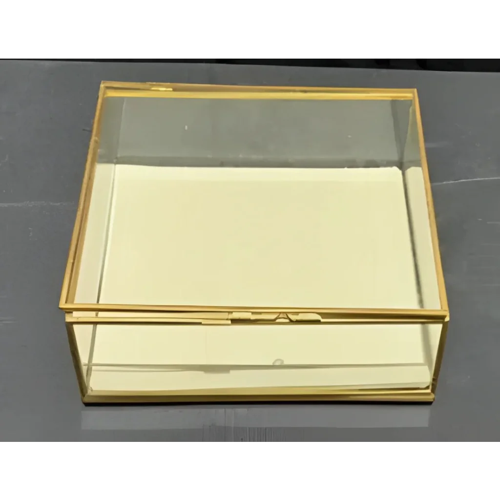 Glass jewelry box with gold trim and felt bottom, perfect for your jewelry collection