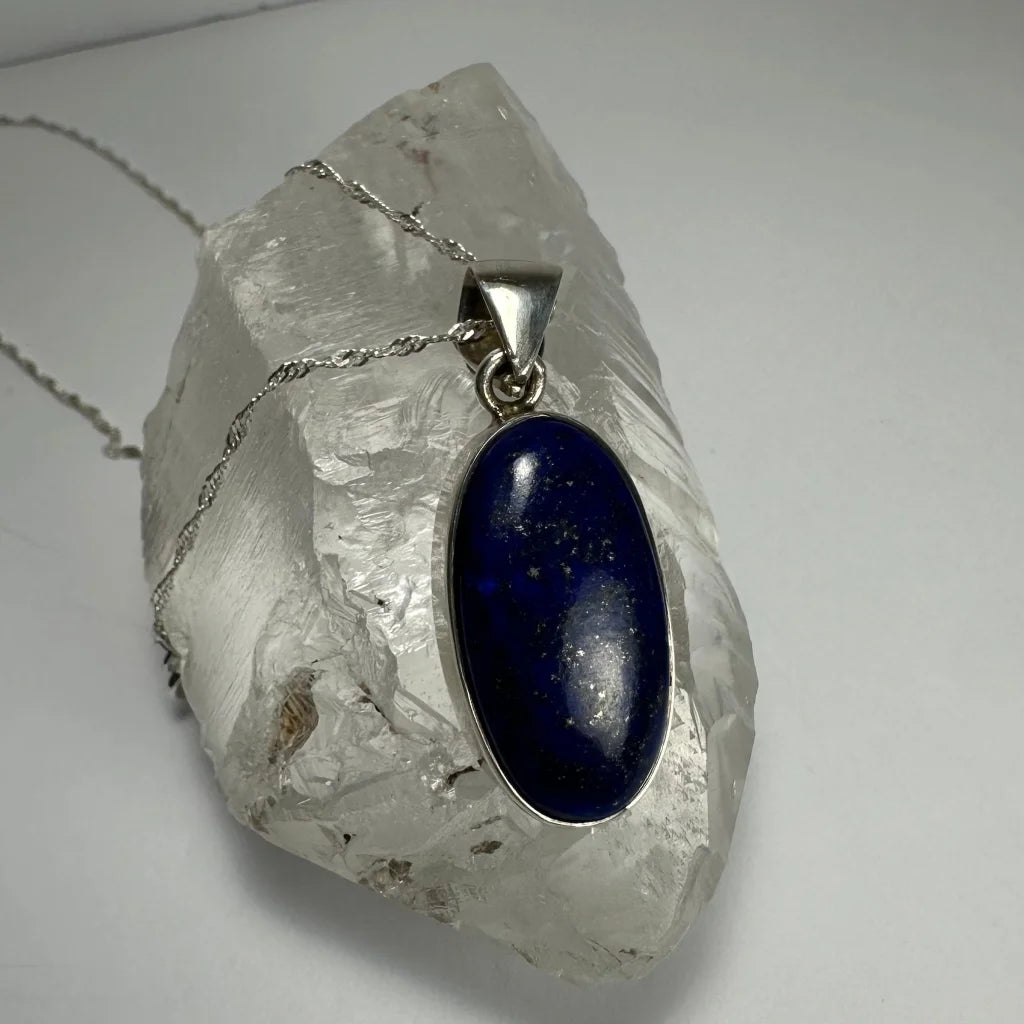Stunning lapis lazuli pendant in sterling silver with deep blue oval stone