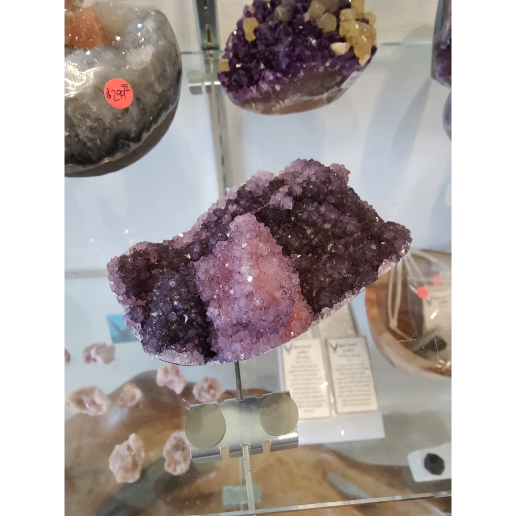 Stunning purple amethyst geode sculpture with sparkling crystals