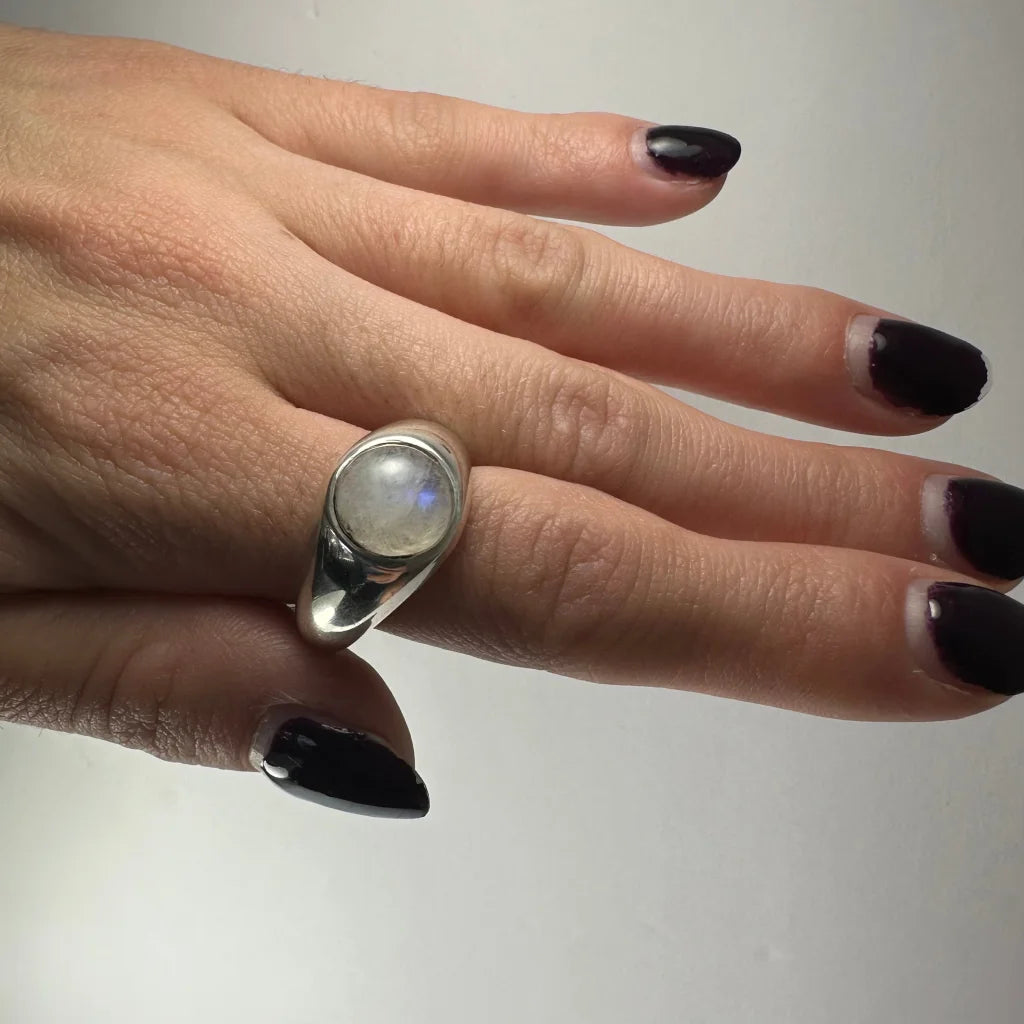Sleek sterling silver moonstone ring with stunning oval rainbow stone