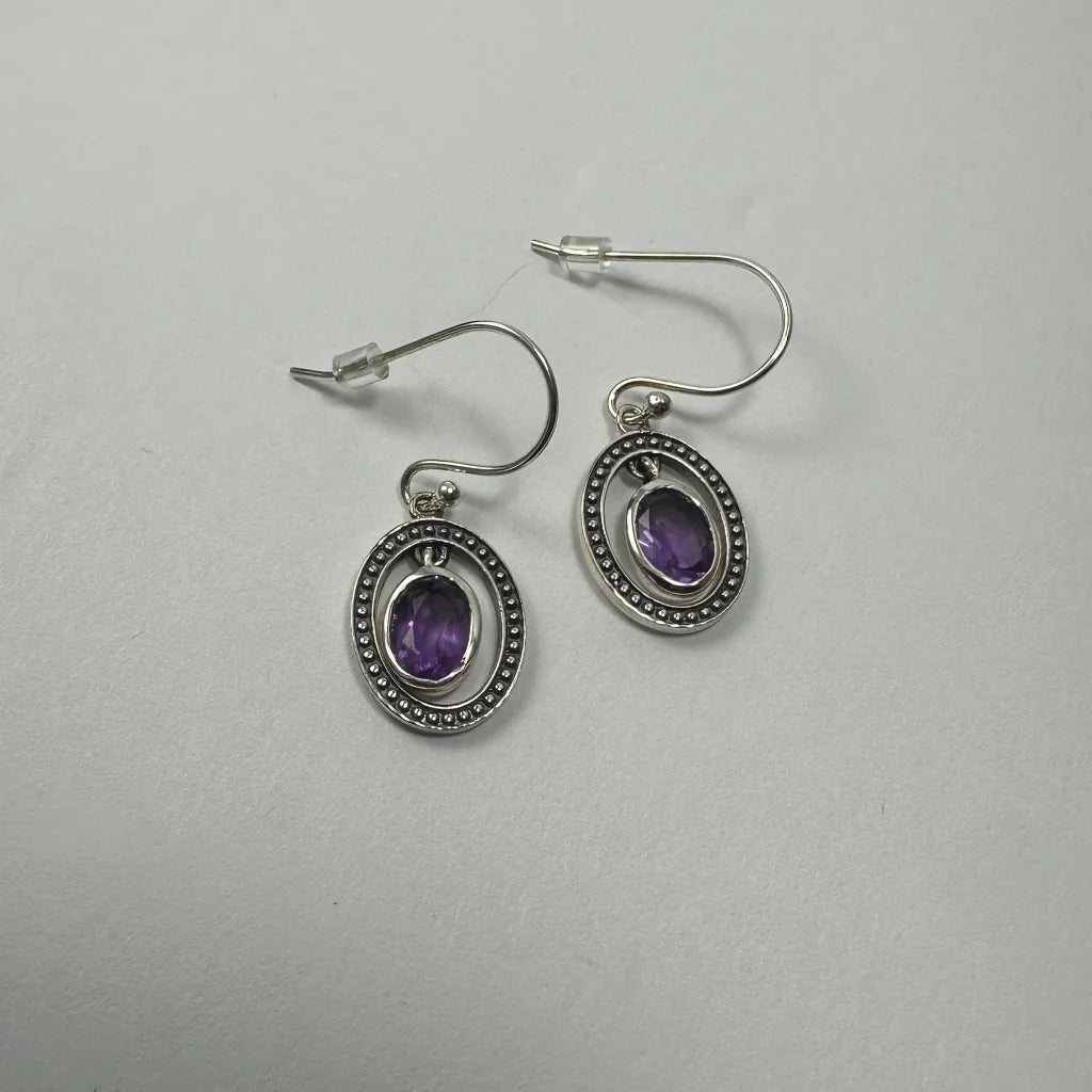 Stunning silver amethyst earrings with oval bezel-set purple stone and beaded border