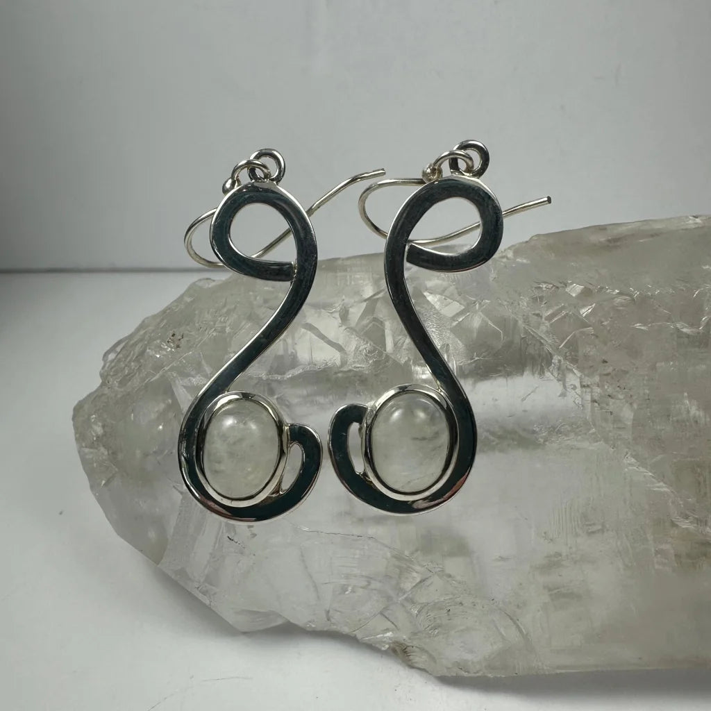 Handcrafted silver moonstone earrings with swirling wire design