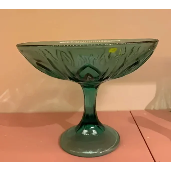 Teal glass clake serving stand with decorative bowl and fluted stem for parties