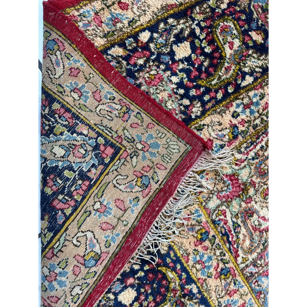 Vintage Kirman Persian rug with floral medallion in blues, pinks, golds