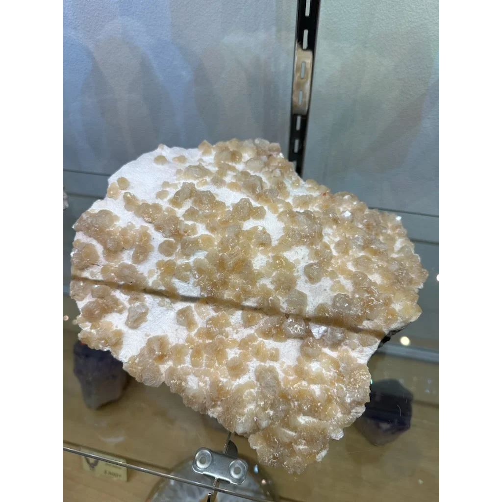 Stunning yellow orange heulandite crystal from India with translucent golden-brown formation