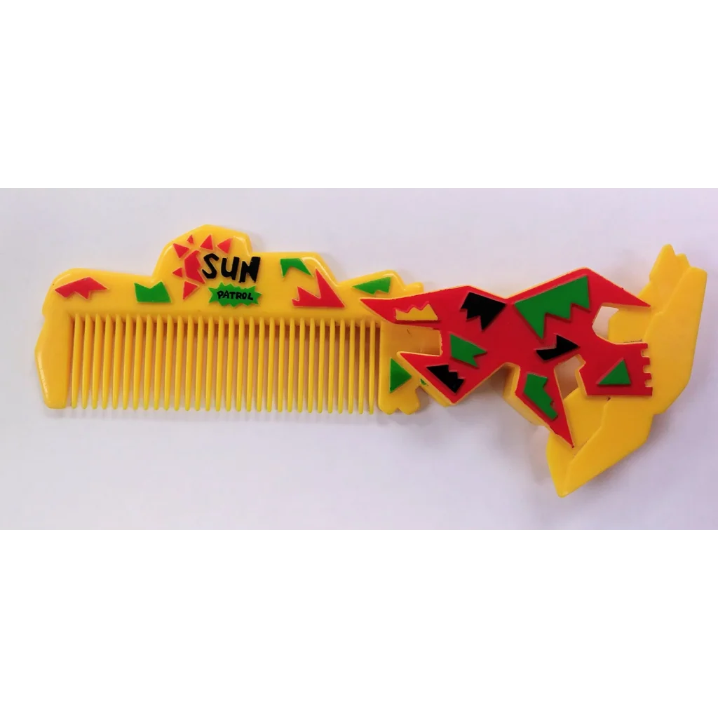 Yellow sun patrol comb with red green accents and sun handle design