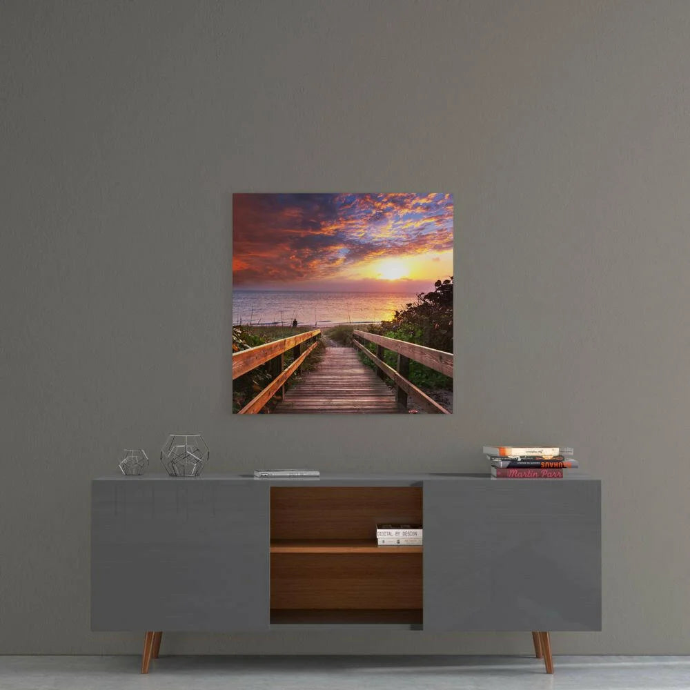 Vibrant sunset boardwalk glass wall art with ocean sky