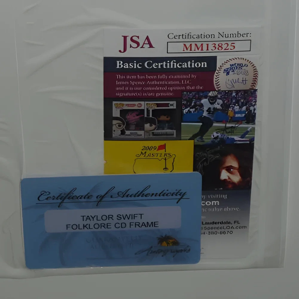 Blue rectangular certificate of authenticity for taylor swift autographed folklore in the trees deluxe framed cd jsa