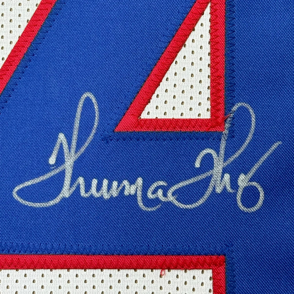 Autographed blue and white Buffalo Bills jersey with red trim for your man cave