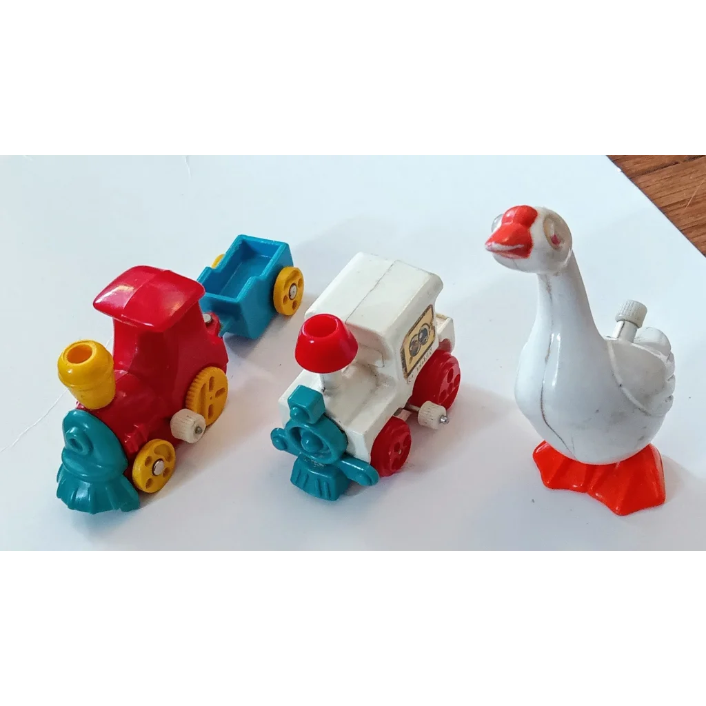Tomy Wind toy set with red blue train engines and white goose figure