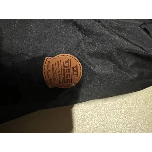 Black D-555 Ski Jacket with brown stitched leather patch for winter adventures